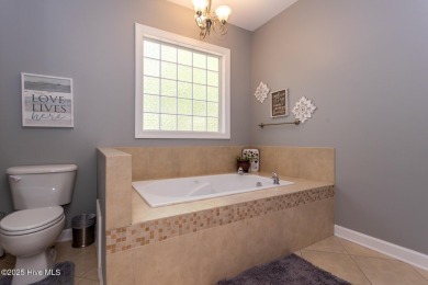Welcome to this bright, open, and family-friendly brick home on on Beacon Ridge Golf and Country Club in North Carolina - for sale on GolfHomes.com, golf home, golf lot