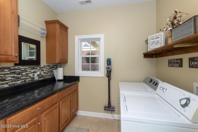 Welcome to this bright, open, and family-friendly brick home on on Beacon Ridge Golf and Country Club in North Carolina - for sale on GolfHomes.com, golf home, golf lot