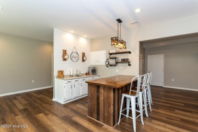 Welcome to this bright, open, and family-friendly brick home on on Beacon Ridge Golf and Country Club in North Carolina - for sale on GolfHomes.com, golf home, golf lot
