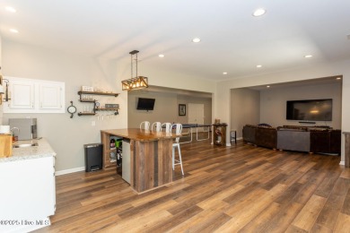 Welcome to this bright, open, and family-friendly brick home on on Beacon Ridge Golf and Country Club in North Carolina - for sale on GolfHomes.com, golf home, golf lot