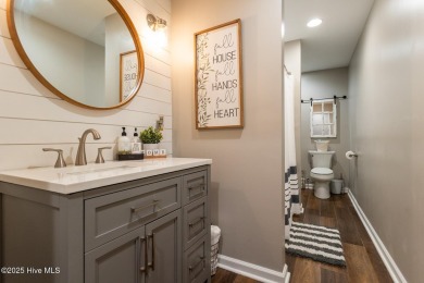 Welcome to this bright, open, and family-friendly brick home on on Beacon Ridge Golf and Country Club in North Carolina - for sale on GolfHomes.com, golf home, golf lot