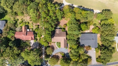 Nestled along the 3rd fairway of the Carolina Trace Lake Course on Carolina Trace Country Club in North Carolina - for sale on GolfHomes.com, golf home, golf lot