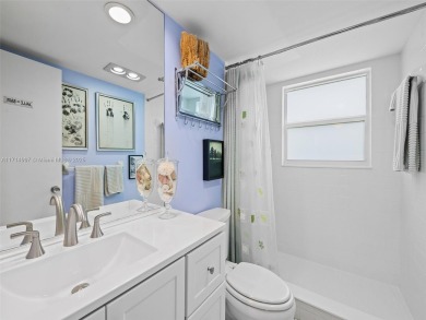Step into South Florida living with this corner-unit stunning on Oaks Country Club in Florida - for sale on GolfHomes.com, golf home, golf lot