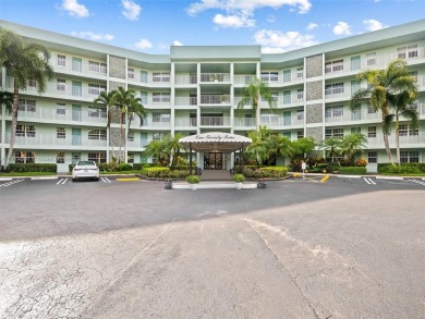 Step into South Florida living with this corner-unit stunning on Oaks Country Club in Florida - for sale on GolfHomes.com, golf home, golf lot
