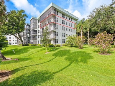 Step into South Florida living with this corner-unit stunning on Oaks Country Club in Florida - for sale on GolfHomes.com, golf home, golf lot