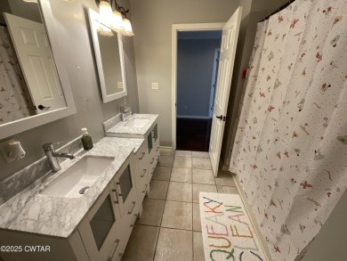 Peaceful and spacious 5 Bedroom, 3.5 bath all brick home on Dyersburg Country Club At The Farms in Tennessee - for sale on GolfHomes.com, golf home, golf lot