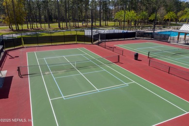 Nestled within the gated golf community of Cimarrone Golf & on Cimarrone Golf and Country Club in Florida - for sale on GolfHomes.com, golf home, golf lot