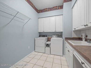 Located in Glen Lakes, this impeccably maintained 2000 built on Glen Lakes Country Club in Florida - for sale on GolfHomes.com, golf home, golf lot