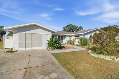 Discover this spacious 4-bed, 3-bath home at 818 N Country Club on Plantation Inn and Golf Resort  in Florida - for sale on GolfHomes.com, golf home, golf lot