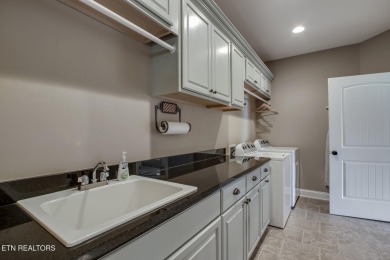 Experience refined living in this stunning 6,513 sq. ft on Wind River Golf Course in Tennessee - for sale on GolfHomes.com, golf home, golf lot