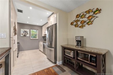 Stunning renovated condo w/ impact windows and unlimited golf in on Monterey Yacht and Country Club in Florida - for sale on GolfHomes.com, golf home, golf lot