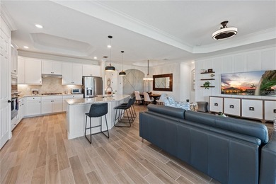 Enjoy expansive golf course views and spectacular western on Lakewood National Golf Club in Florida - for sale on GolfHomes.com, golf home, golf lot