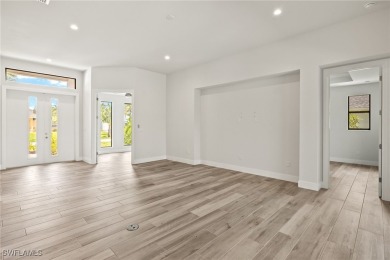 This home has all of the boxes checked!  Built 2022! Split on Royal Tee Country Club in Florida - for sale on GolfHomes.com, golf home, golf lot