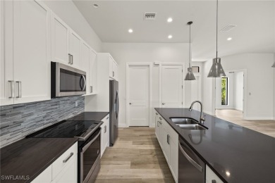 This home has all of the boxes checked!  Built 2022! Split on Royal Tee Country Club in Florida - for sale on GolfHomes.com, golf home, golf lot