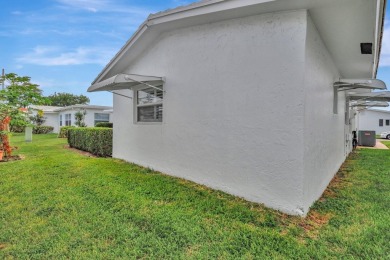 Only your toothbrush needed. Decorative Expanded Driveway on Leisureville Community Golf Course in Florida - for sale on GolfHomes.com, golf home, golf lot