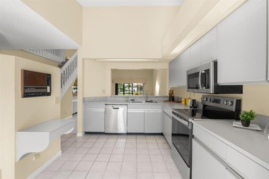 Great buy! Just reduced! Spacious, bright corner-unit townhome on Woodmont Country Club in Florida - for sale on GolfHomes.com, golf home, golf lot