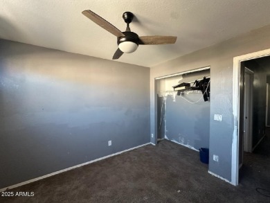 Investor special! Spacious 5-bedroom, 2.5-bath fixer-upper on Oasis Golf Club in Arizona - for sale on GolfHomes.com, golf home, golf lot