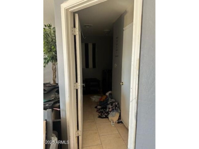 Investor special! Spacious 5-bedroom, 2.5-bath fixer-upper on Oasis Golf Club in Arizona - for sale on GolfHomes.com, golf home, golf lot