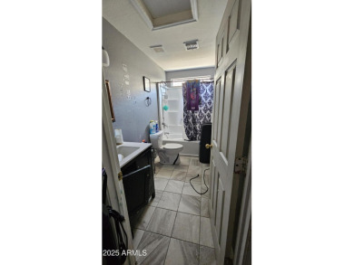 Investor special! Spacious 5-bedroom, 2.5-bath fixer-upper on Oasis Golf Club in Arizona - for sale on GolfHomes.com, golf home, golf lot