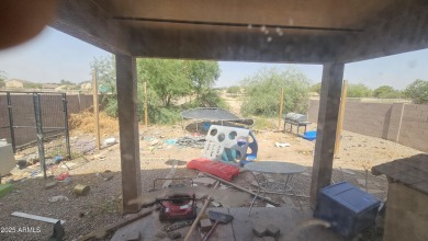 Investor special! Spacious 5-bedroom, 2.5-bath fixer-upper on Oasis Golf Club in Arizona - for sale on GolfHomes.com, golf home, golf lot