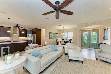 WATERFRONT LUXURY AWAITS at this gorgeous 2013 built custom POOL on Saint Andrews South Golf Club in Florida - for sale on GolfHomes.com, golf home, golf lot