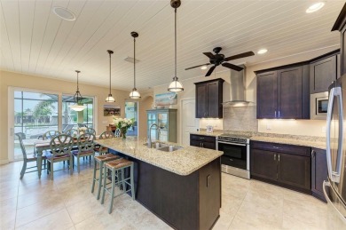 WATERFRONT LUXURY AWAITS at this gorgeous 2013 built custom POOL on Saint Andrews South Golf Club in Florida - for sale on GolfHomes.com, golf home, golf lot