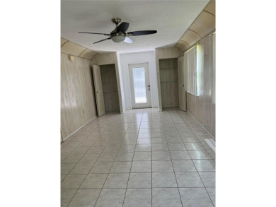 What a GEM of a house....Great Curb Appeal.....  Just a Hop on Highland Lakes Executive Golf Course in Florida - for sale on GolfHomes.com, golf home, golf lot