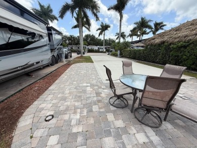 This prime pull-in lot offers breathtaking golf course and water on Motorcoach Resort Golf Course in Florida - for sale on GolfHomes.com, golf home, golf lot