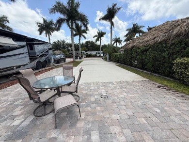 This prime pull-in lot offers breathtaking golf course and water on Motorcoach Resort Golf Course in Florida - for sale on GolfHomes.com, golf home, golf lot