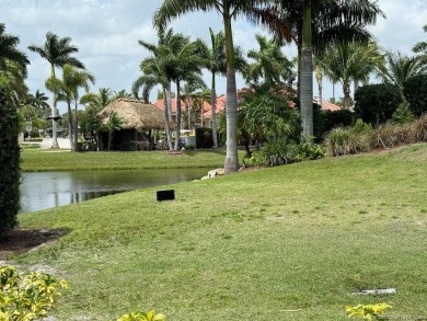This prime pull-in lot offers breathtaking golf course and water on Motorcoach Resort Golf Course in Florida - for sale on GolfHomes.com, golf home, golf lot