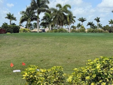 This prime pull-in lot offers breathtaking golf course and water on Motorcoach Resort Golf Course in Florida - for sale on GolfHomes.com, golf home, golf lot
