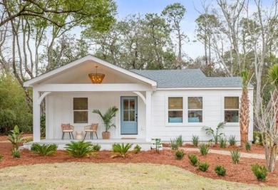 Don't let the darling front porch and quaint facade fool you on Sea Island Golf Club in Georgia - for sale on GolfHomes.com, golf home, golf lot