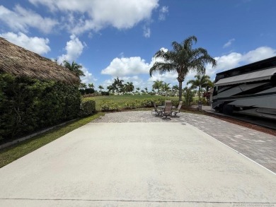 This prime pull-in lot offers breathtaking golf course and water on Motorcoach Resort Golf Course in Florida - for sale on GolfHomes.com, golf home, golf lot