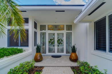 A Masterpiece of Modern Luxury and Timeless EleganceThis on Atlantis Golf Club in Florida - for sale on GolfHomes.com, golf home, golf lot