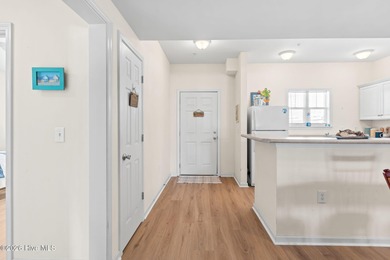 Experience easy coastal living in this fully furnished 2-bedroom on South Harbour Golf Links in North Carolina - for sale on GolfHomes.com, golf home, golf lot