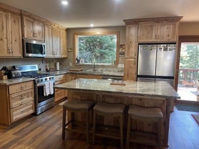 This wonderfully updated 3-bedroom, 2-bathroom home is nestled on Lake Almanor Country Club in California - for sale on GolfHomes.com, golf home, golf lot