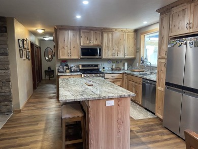 This wonderfully updated 3-bedroom, 2-bathroom home is nestled on Lake Almanor Country Club in California - for sale on GolfHomes.com, golf home, golf lot