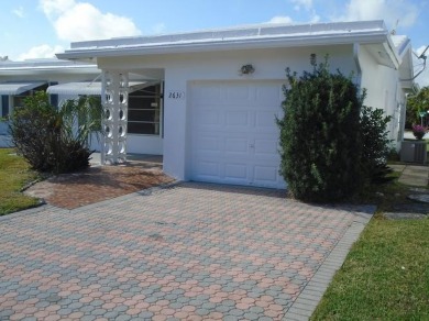 Larger model home in the highly sought-after golf course on Leisureville Community Association in Florida - for sale on GolfHomes.com, golf home, golf lot