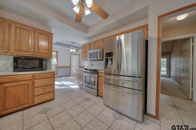 Welcome home to this beautiful 3-bedroom, 2-bathroom retreat on Hide-A-Way Lake Golf Course in Texas - for sale on GolfHomes.com, golf home, golf lot