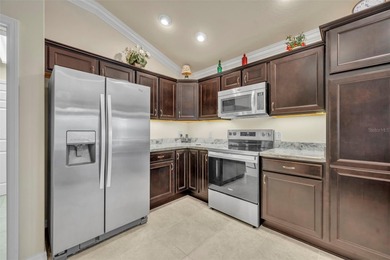 Stunning Expanded Iris Designer Home in the Village of on Egret Championship Golf Course in Florida - for sale on GolfHomes.com, golf home, golf lot