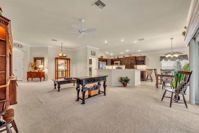 Stunning Expanded Iris Designer Home in the Village of on Egret Championship Golf Course in Florida - for sale on GolfHomes.com, golf home, golf lot