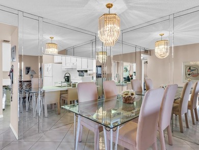 Enjoy stunning lake views from this bright, corner 2-bedroom on Sunrise Lakes Phase IV Golf Course in Florida - for sale on GolfHomes.com, golf home, golf lot