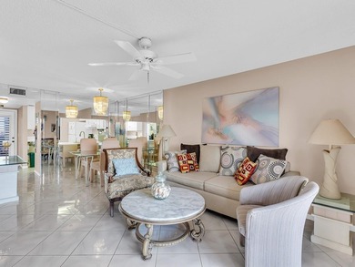 Enjoy stunning lake views from this bright, corner 2-bedroom on Sunrise Lakes Phase IV Golf Course in Florida - for sale on GolfHomes.com, golf home, golf lot