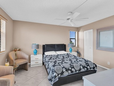 Enjoy stunning lake views from this bright, corner 2-bedroom on Sunrise Lakes Phase IV Golf Course in Florida - for sale on GolfHomes.com, golf home, golf lot