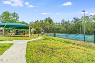 This 2 bedroom, 1.5 bath townhome is situated in a beautiful on Hedingham Golf and Athletic Club in North Carolina - for sale on GolfHomes.com, golf home, golf lot