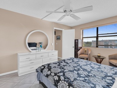 Enjoy stunning lake views from this bright, corner 2-bedroom on Sunrise Lakes Phase IV Golf Course in Florida - for sale on GolfHomes.com, golf home, golf lot