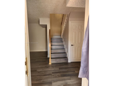 Wake up every morning to a serene golf course and water views in on Pine Island Ridge Country Club in Florida - for sale on GolfHomes.com, golf home, golf lot