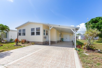 Welcome home to this mmaculate move-in-ready 2 bedroom 2 bath on Barefoot Bay Golf Course in Florida - for sale on GolfHomes.com, golf home, golf lot