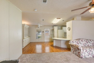 Welcome home to this mmaculate move-in-ready 2 bedroom 2 bath on Barefoot Bay Golf Course in Florida - for sale on GolfHomes.com, golf home, golf lot