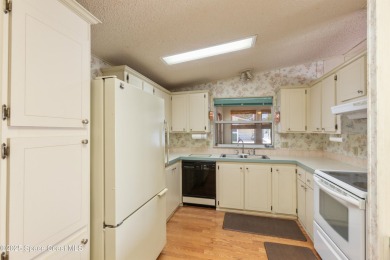 Welcome home to this mmaculate move-in-ready 2 bedroom 2 bath on Barefoot Bay Golf Course in Florida - for sale on GolfHomes.com, golf home, golf lot